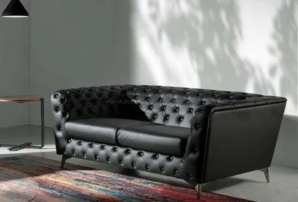 Canape type chesterfield en cuir noir capitonne