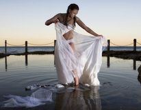 Bride ripping off dress in water2