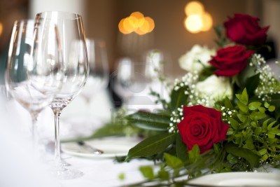 10743848 wedding table decoration rose photo shows a nice red rose on a wedding decorated table with soft li