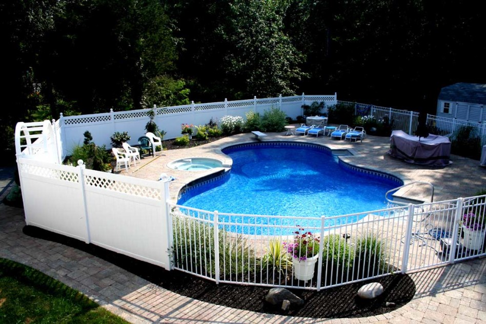 Pool enchanting backyard design and decoration using white iron metal pool fence including landscaping around the pool and shaped backyard swimming pool fascinating backyard landscaping decoration wit 948x632