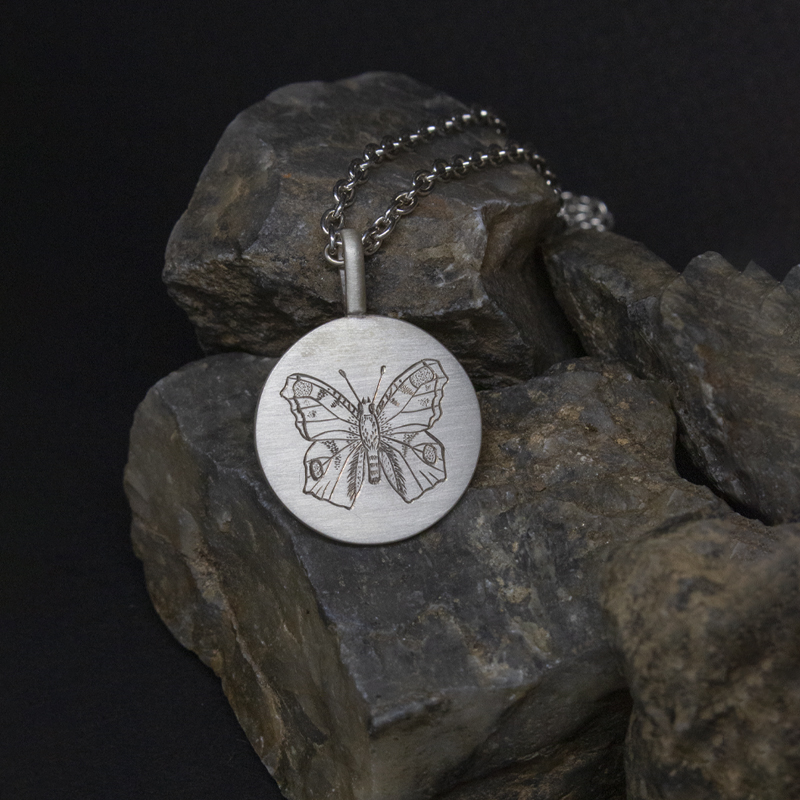Medaille gravee paon de jour