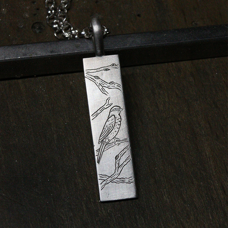 Medaille gravee oiseau