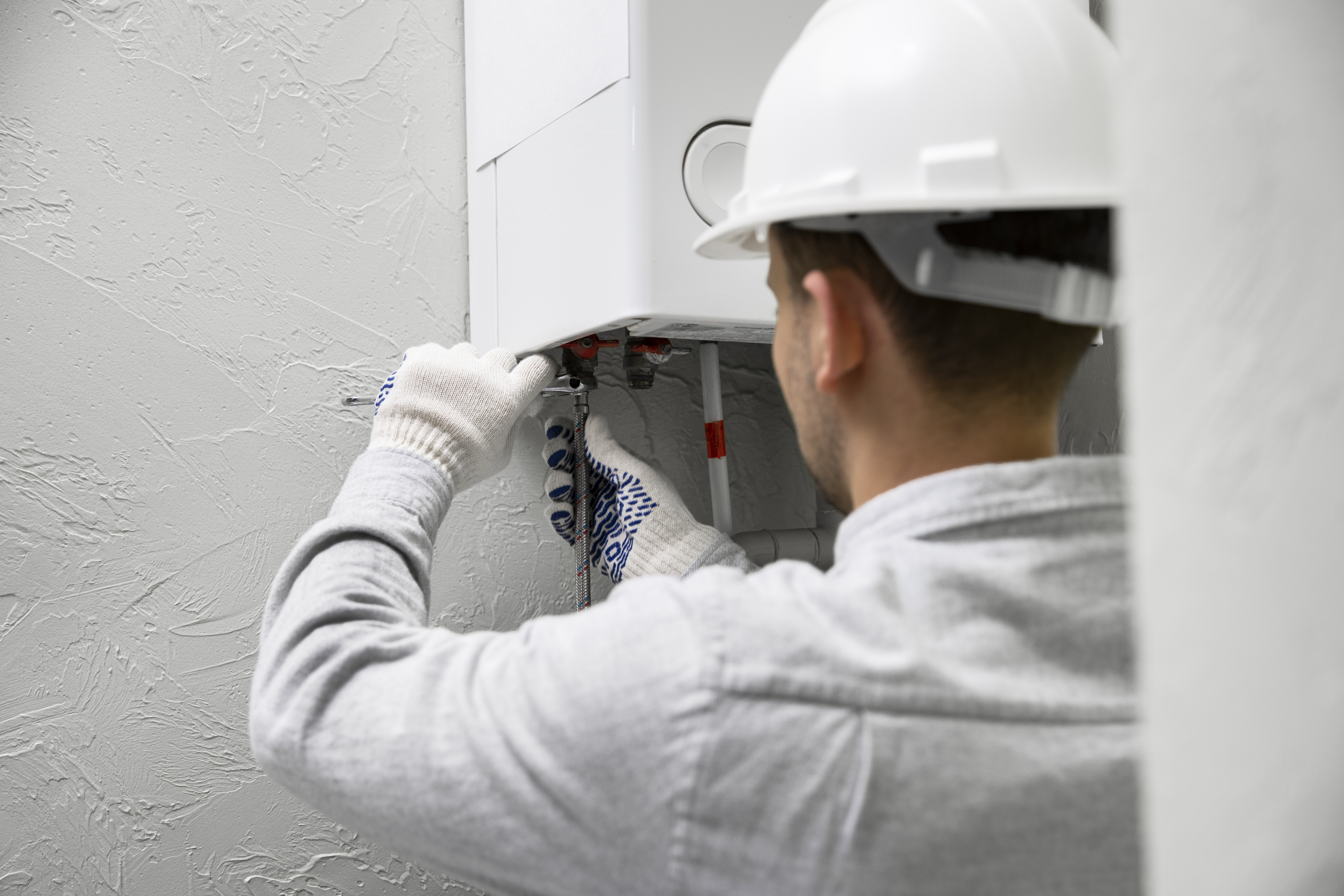 Worker-repairing-water-heater-2