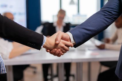 Satisfied businessman company employer wearing suit handshake new employee get hired job interview man hr manager employ successful candidate shake hand business meeting placement concept 1 