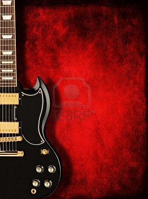 5764979 guitare electrique noir sur fond rouge fonce