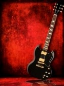 5764980 guitare electrique noir sur fond rouge grunge