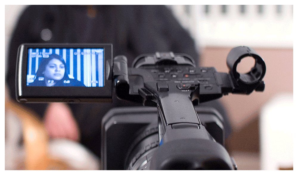 Camera operator setting up the video camera jwawkins