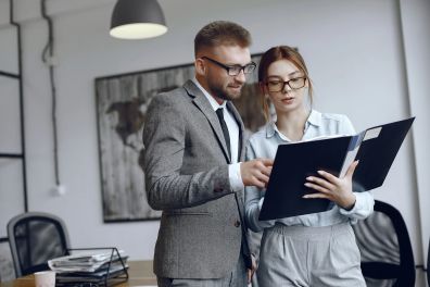 Woman-with-glasses-businessman-with-documents-colleagues-work-together-1-