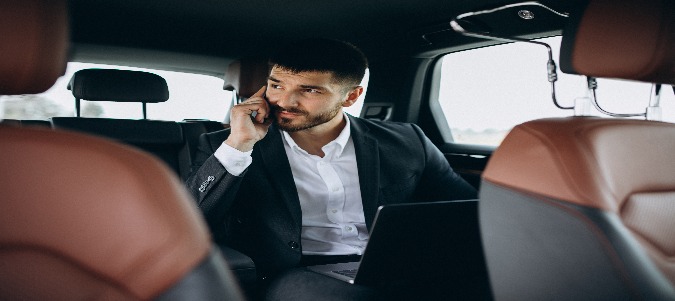 M handsome business man working computer car