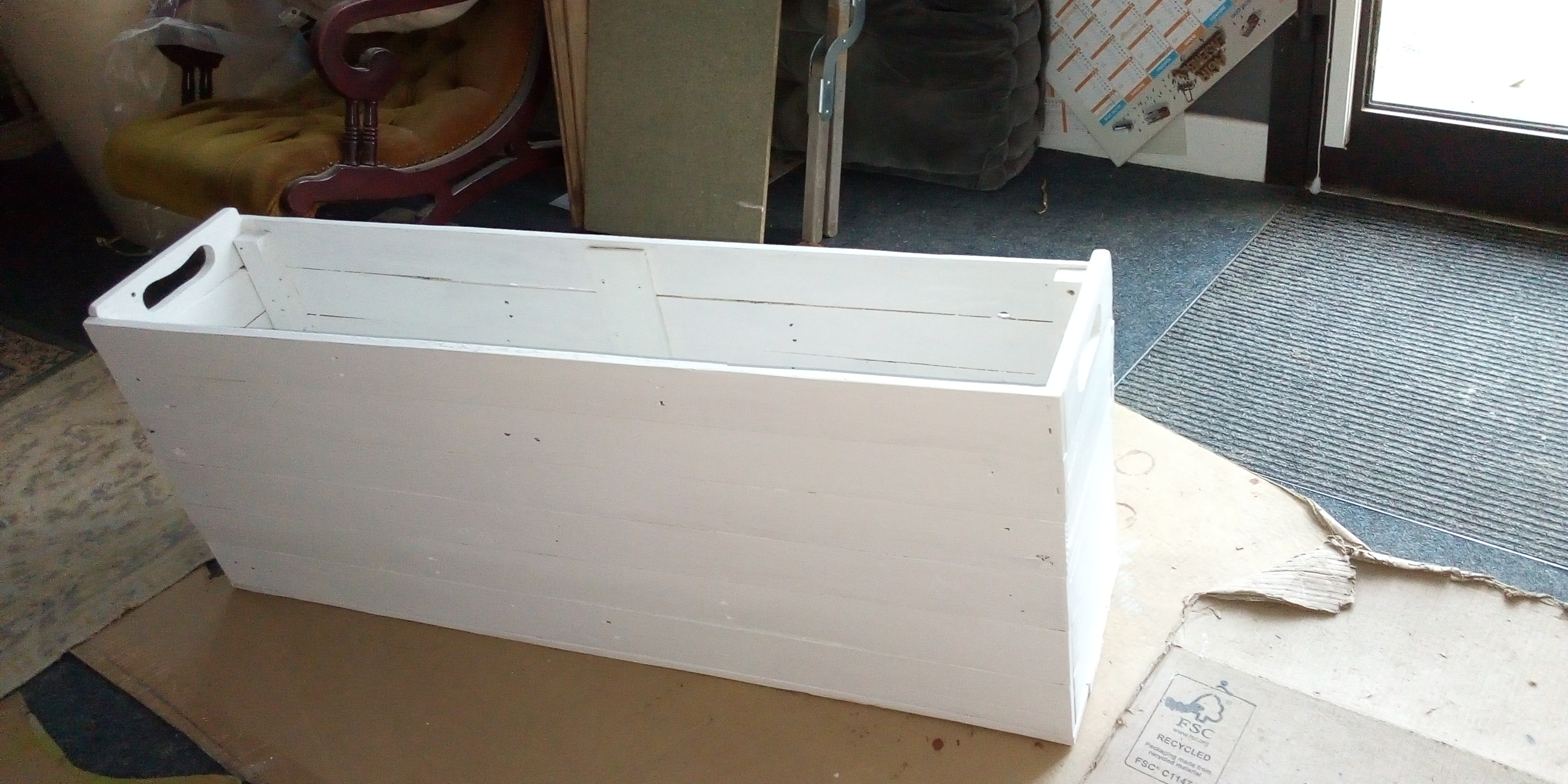 Caisse pour rouleaux de tissus