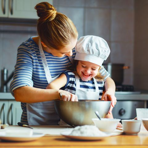 Happy-family-in-kitchen-mother-and-child-preparing-royalty-free-image-1586420711