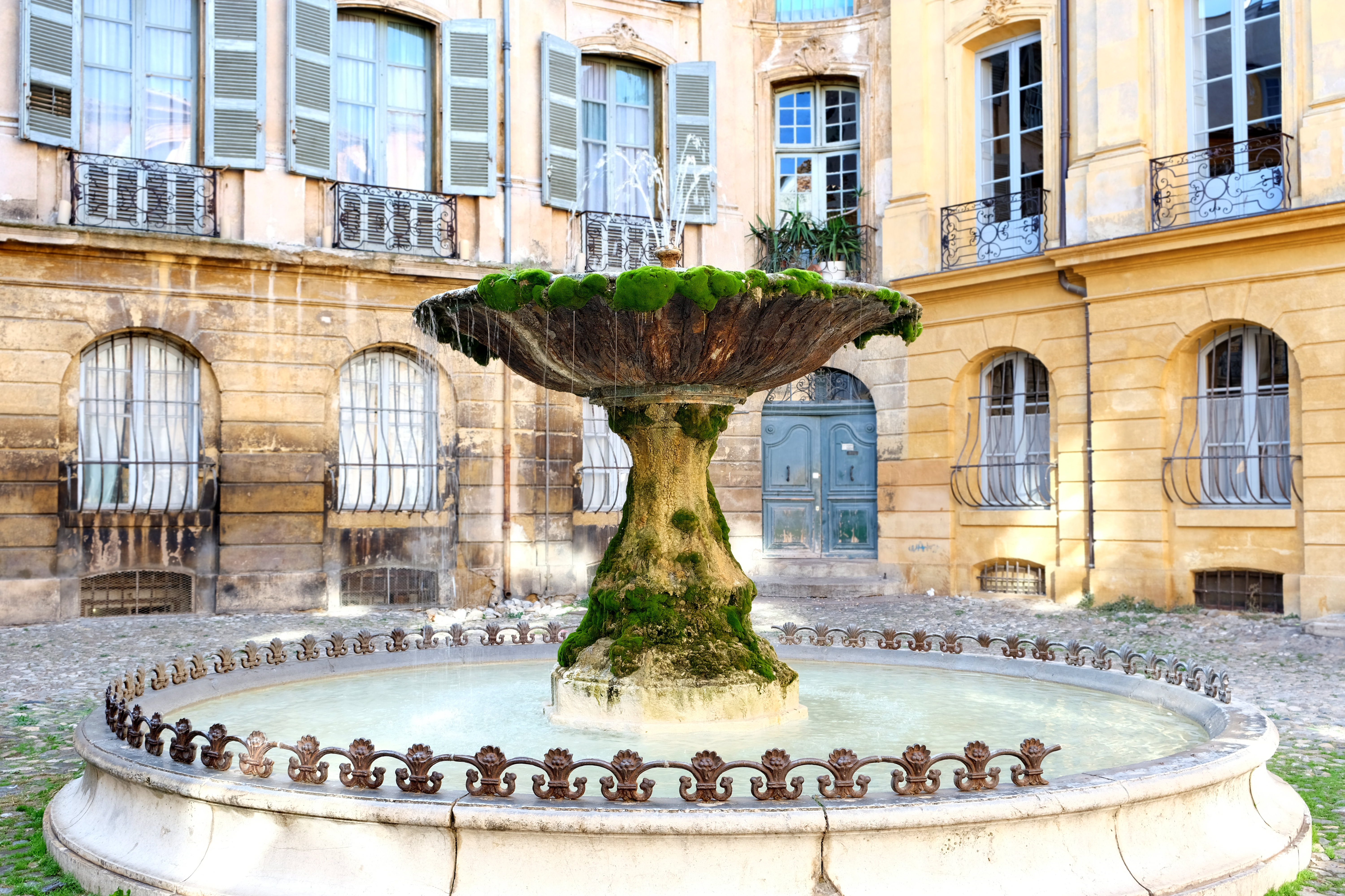 Famous old ancient moss covered fountain aix provence france