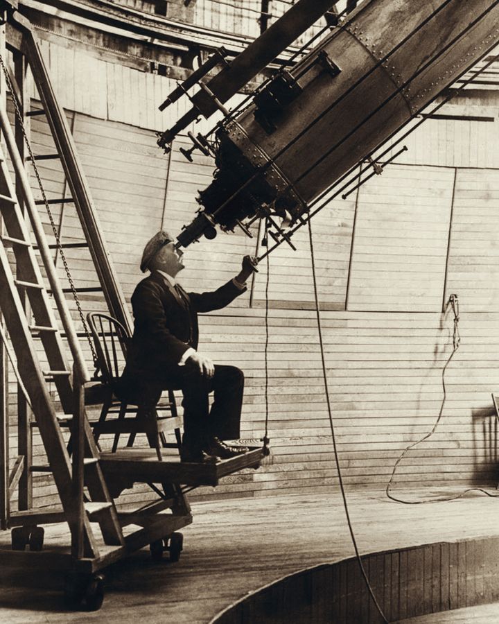 Percival lowell observing venus from the lowell observatory in 1914
