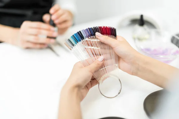 Depositphotos 163532164 stock photo woman choosing nail polish color