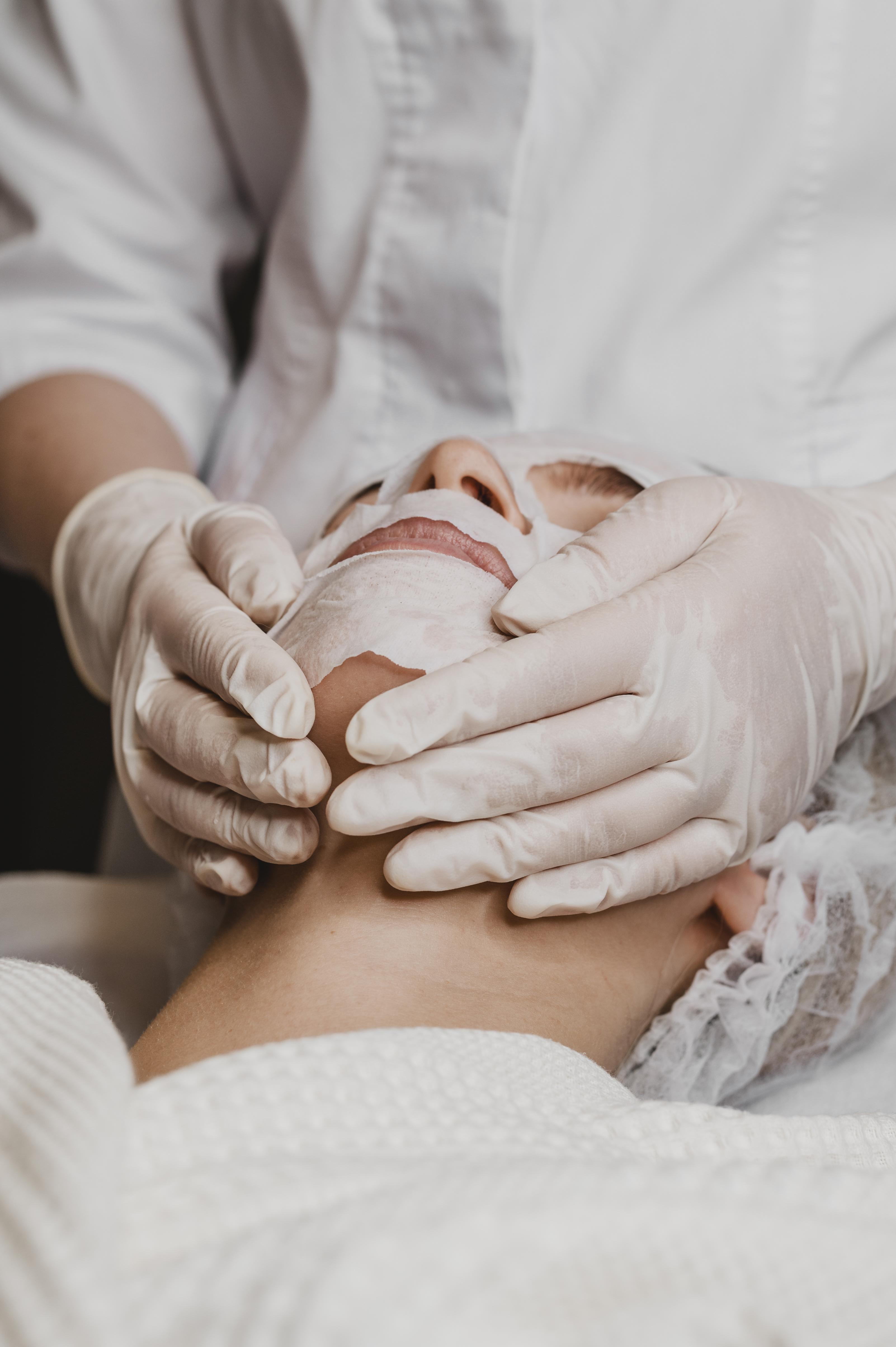 Young-beautiful-woman-getting-skin-mask-treatment
