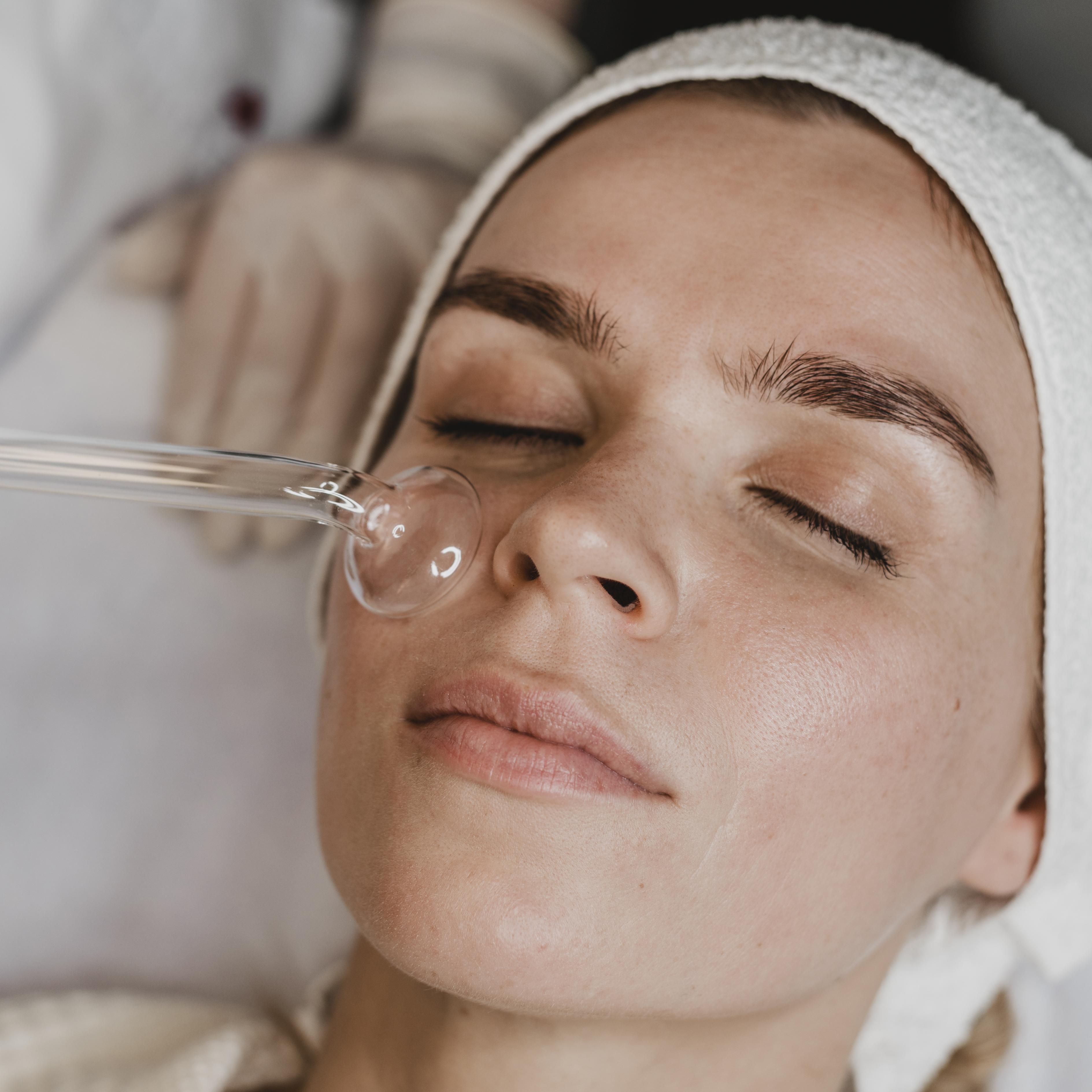 Woman-getting-facial-skin-treatment-wellness-center