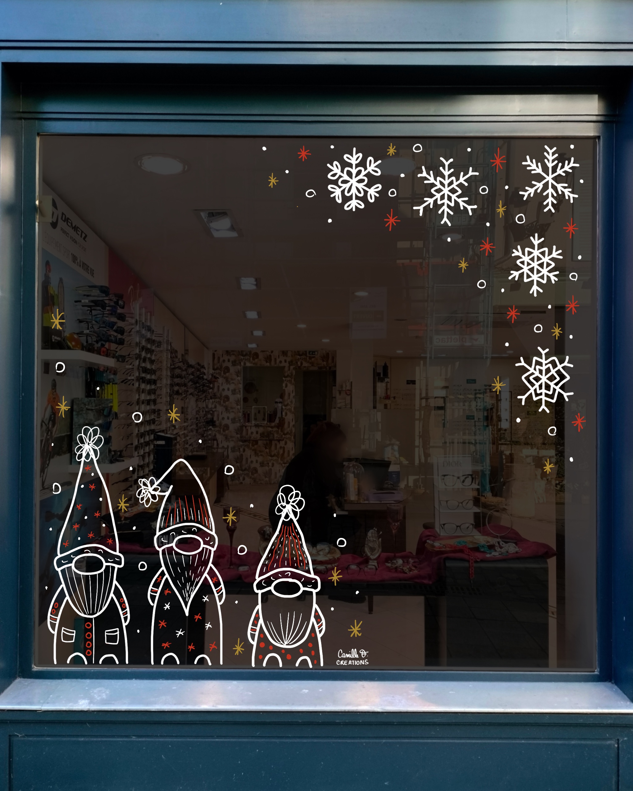 Peinture sur vitrine à Paris ou dans les Yvelines sur le thème de Noël avec des lutins de Noël rigolos et des flocons de neige