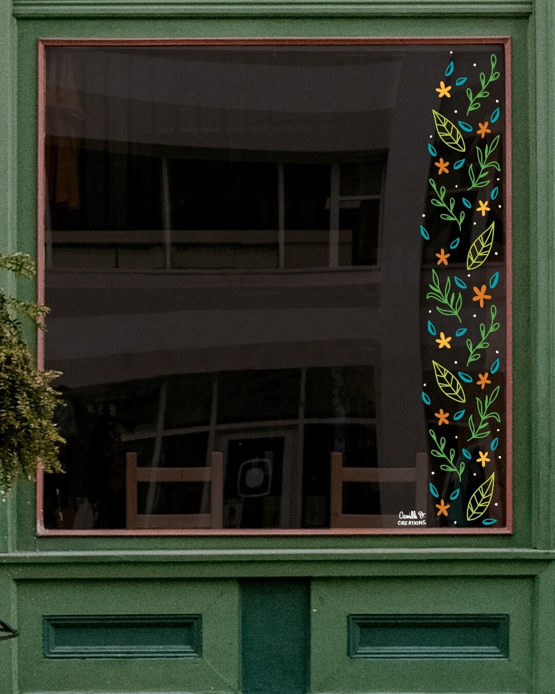Peinture sur vitrine à Paris et dans les Yvelines, bordure végétale et fleurs pour décor vitrine sur le thème du printemps