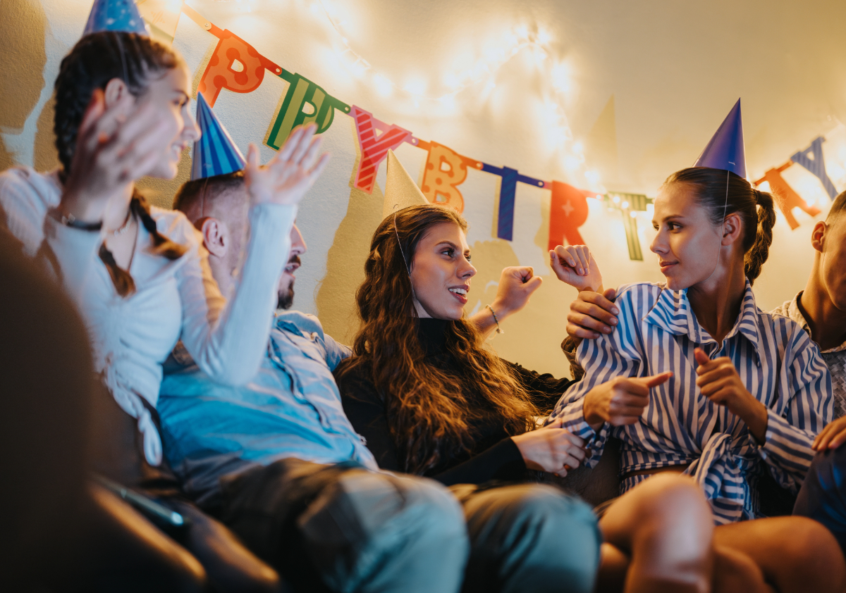 Vistacreate 826376306 stock photo cheerful gathering family members enjoying birthday celebration featuring vibrant decorations