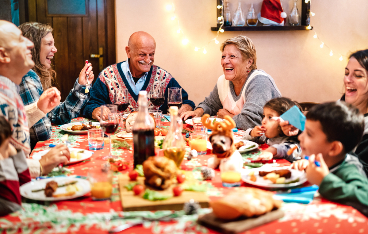 Vistacreate 516340848 stock photo multi generation family having fun christmas dinner event winter holiday