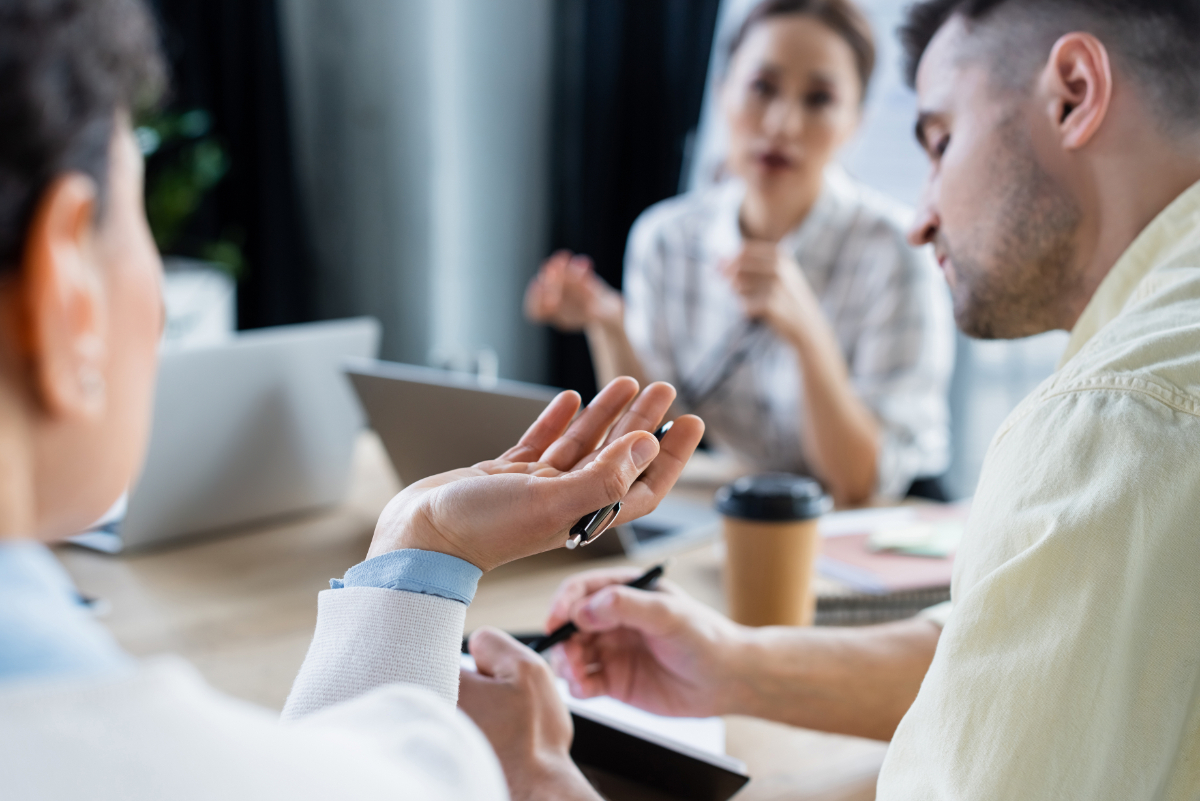 Vistacreate 474165322 stock photo african american businesswoman pen working blurred colleagues