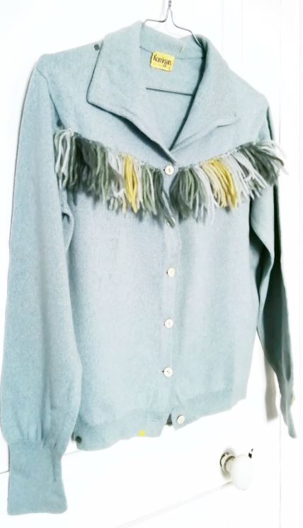 Pull mite suave par un ajout de franges