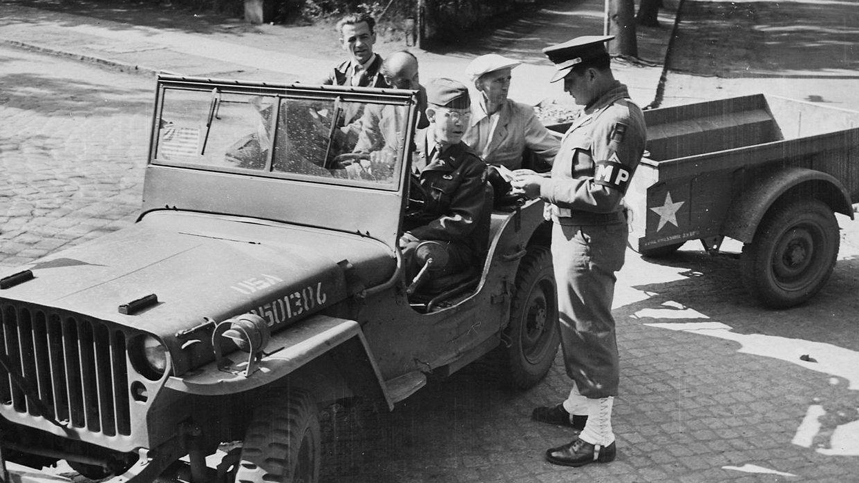 1280px civilian photo technicians in back of jeep working for counter intelligence corps are accounted for by captain nara 198977